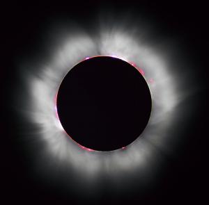 The Sun's corona shines around the intervening Moon during a total solar eclipse