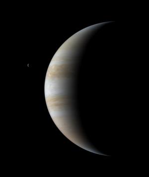 Cassini view of crescent Jupiter and Io