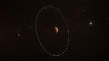 Artist's concept of dwarf planet Quaoar (center) and its ring, with a small moon at left and the sun at the right