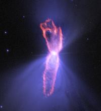 False-color image of the Boomerang Nebula, which is being created by a dying star