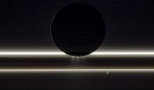 Enceladus passes in front of Saturn's rings