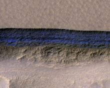 Layers of buried ice exposed on a Martian slope