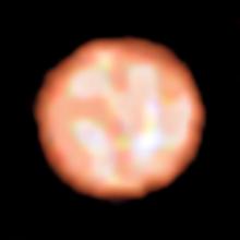 Giant bubbles of hot gas form bright splotches on the surface of a red-giant star