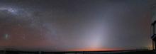 Zodiacal light extends upward from the horizon, with the Milky Way at left