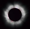 The Sun's corona shines around the intervening Moon during a total solar eclipse